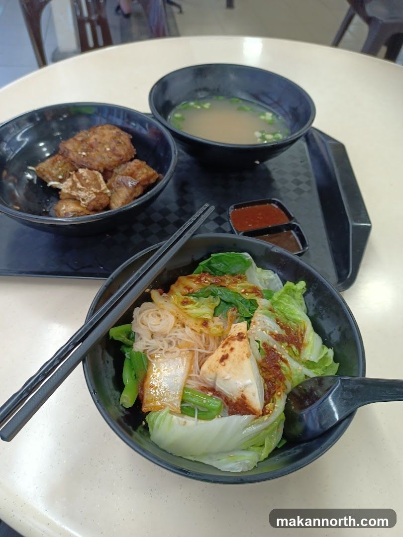 Noodles with vegetables and fried items