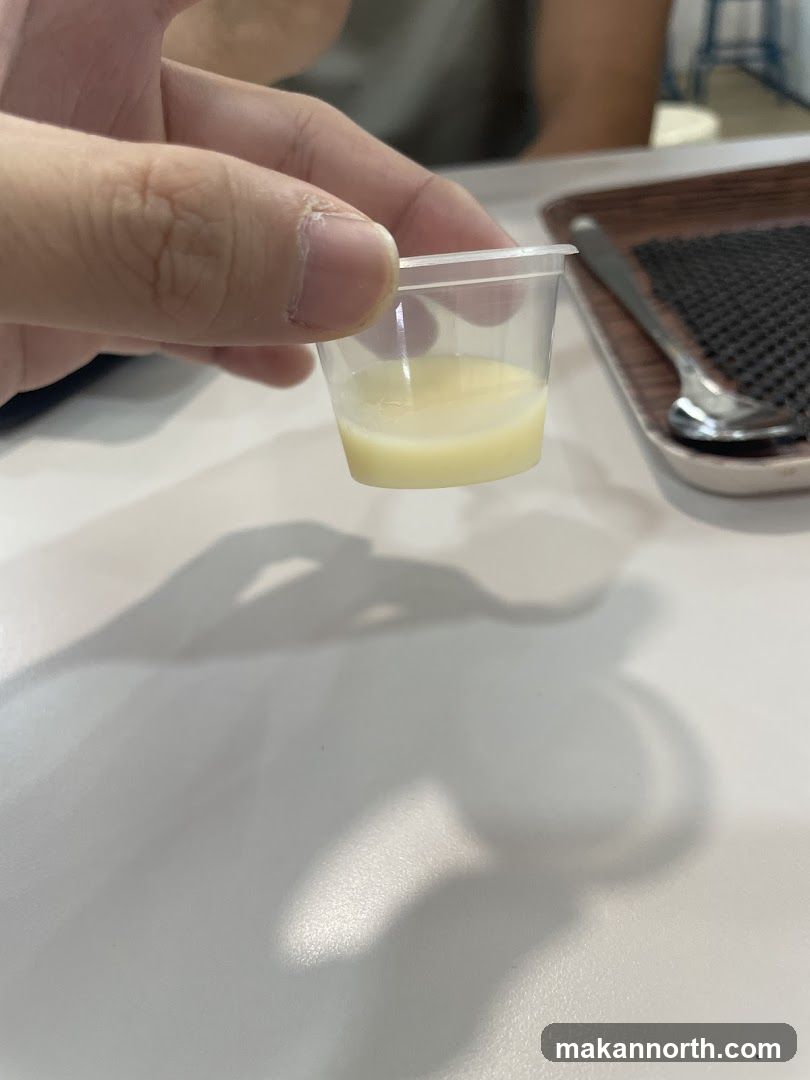 Small Cup of Creamy Liquid