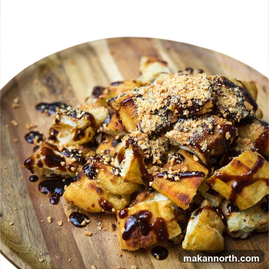 Fried Pastry with Chocolate Sauce and Peanuts