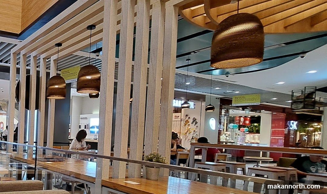 Interior of a cafe with wooden accents and hanging lamps