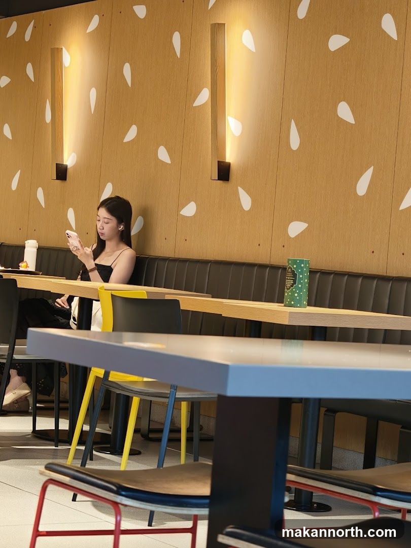 Restaurant Interior with Seated Woman