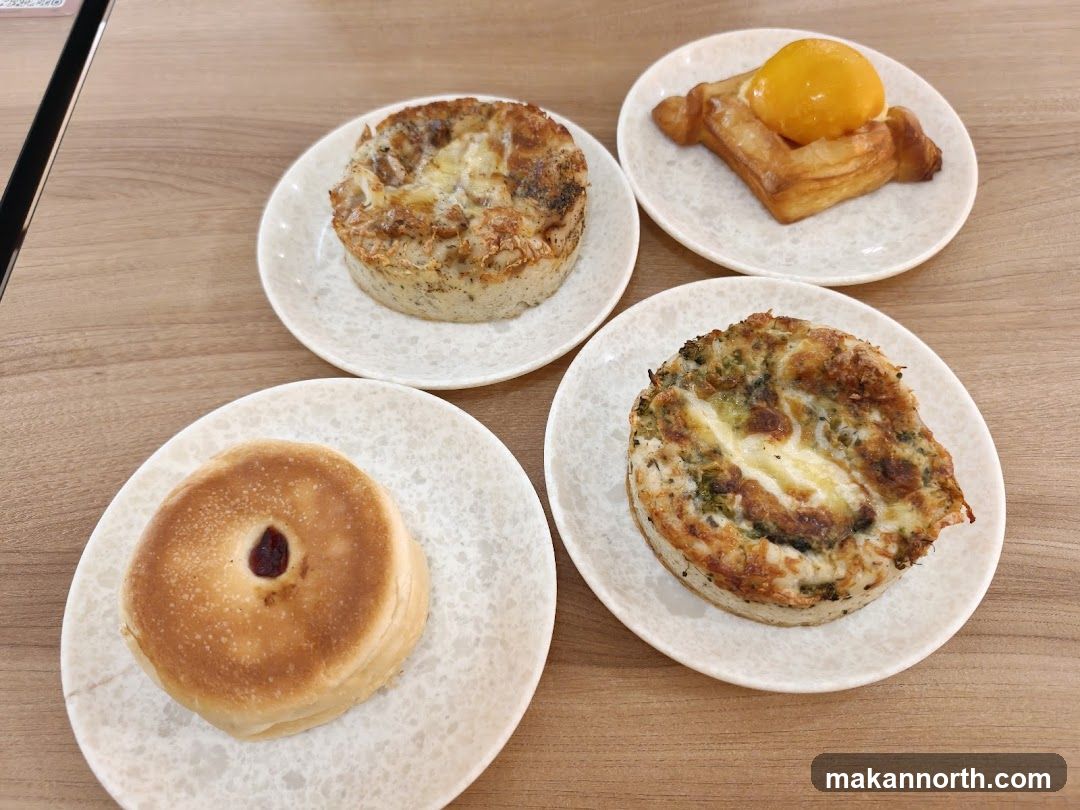 Four pastries on plates