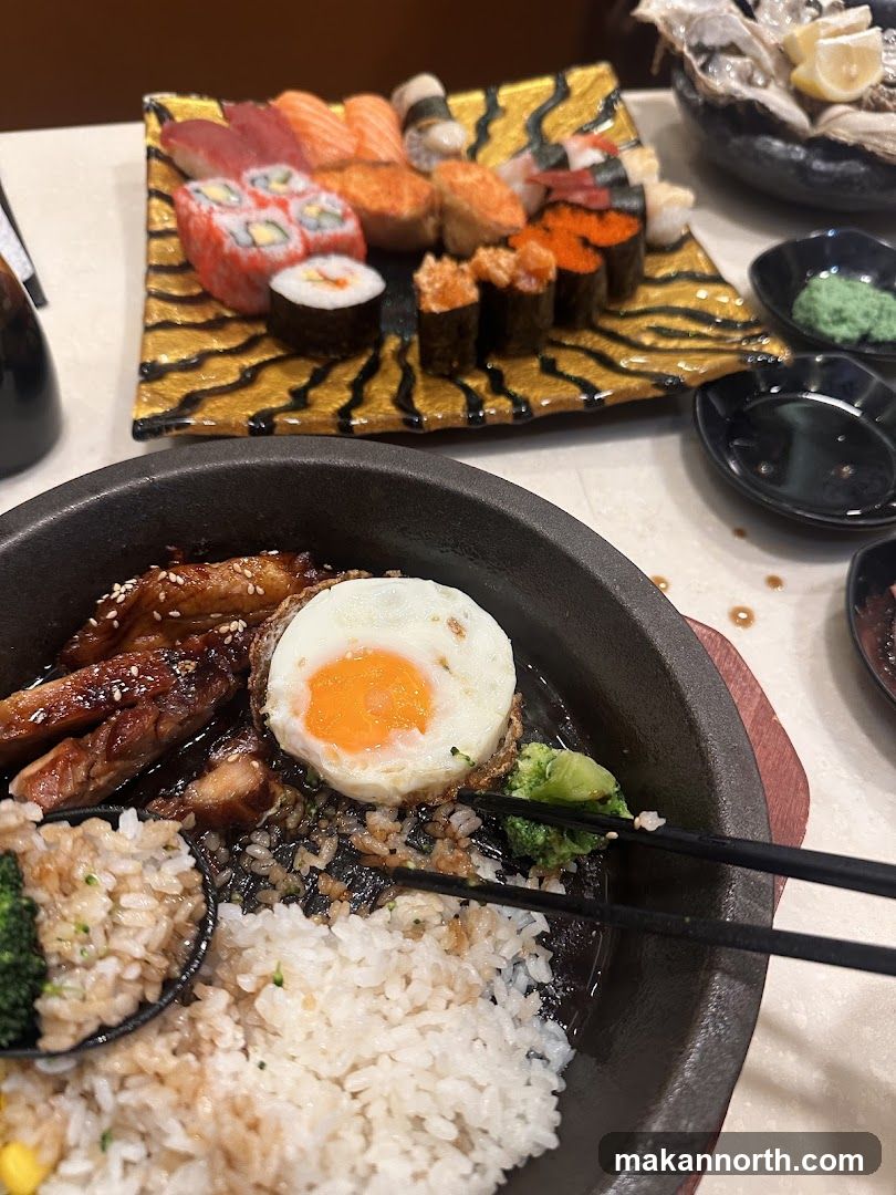 Sizzling Hot Plate with Fried Egg and Sushi Platter