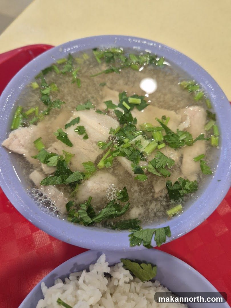 Bowl of Soup with Sliced Meat and Rice