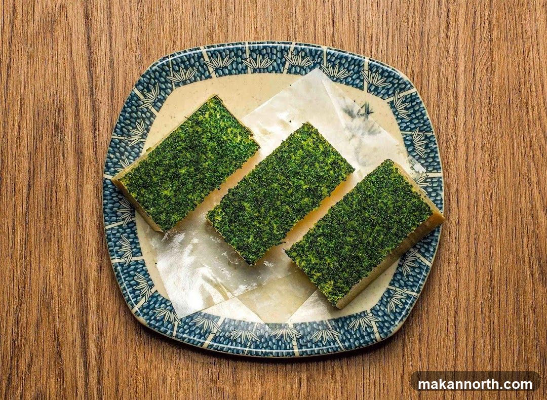 Three Rectangular Food Items with Green Topping