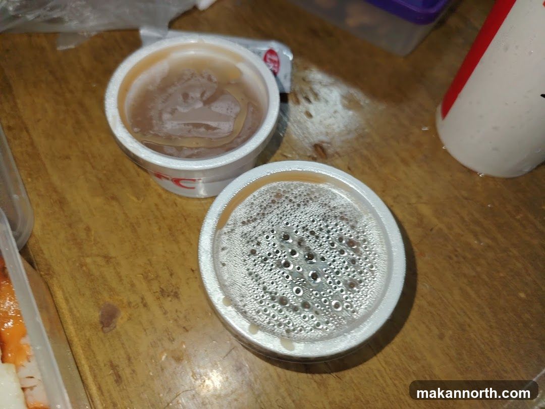 Two cups of food on a wooden table