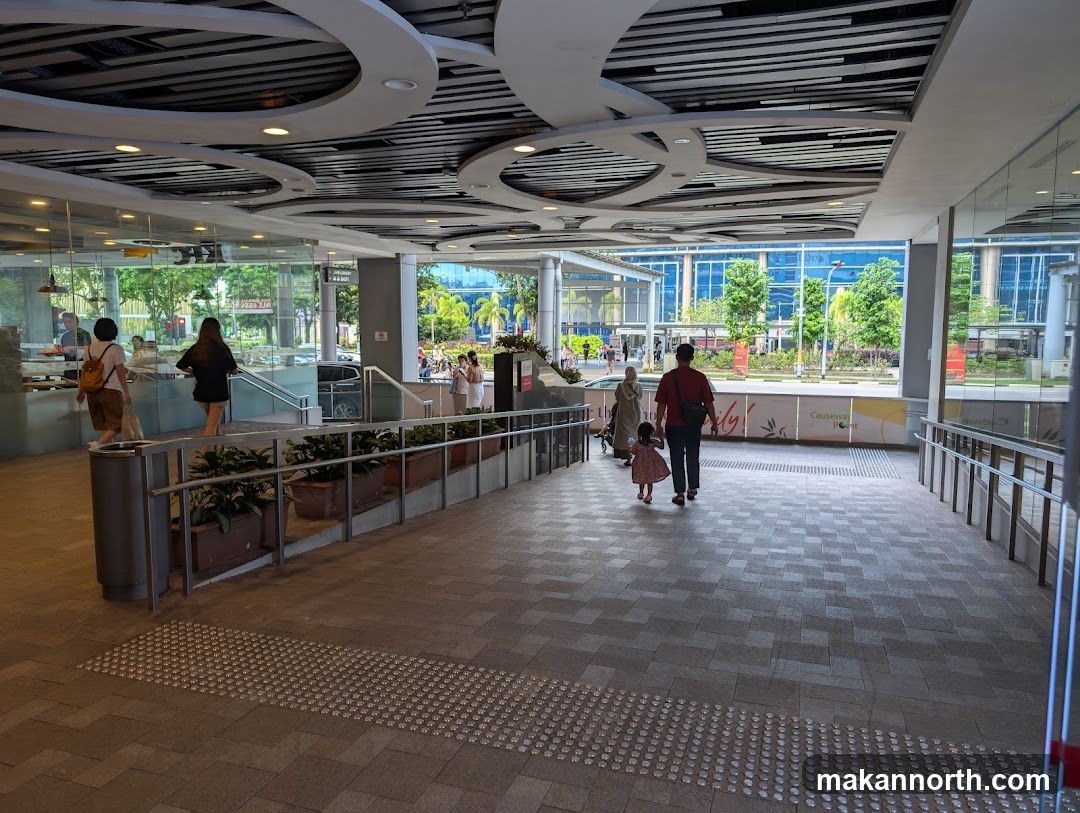 People walking in a modern walkway