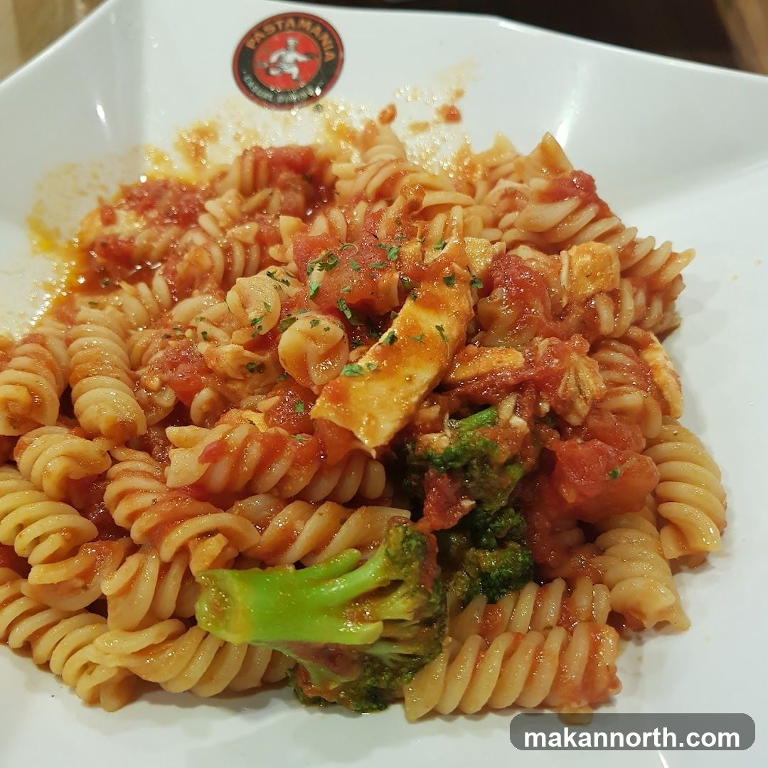 Pasta dish with tomato sauce and broccoli