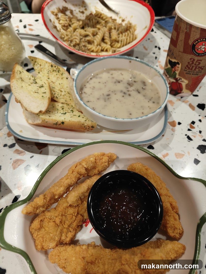 Fried Chicken Strips with Dip, Pasta, and Garlic Bread