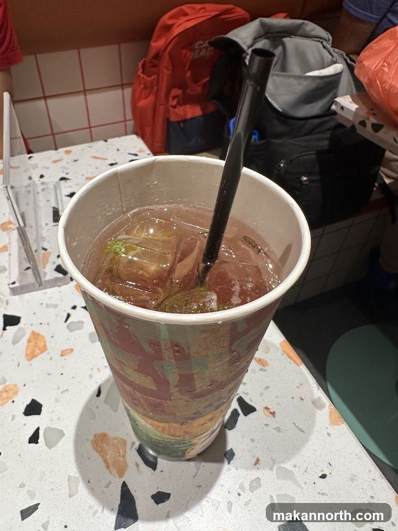 Iced Drink with Lime and Straw