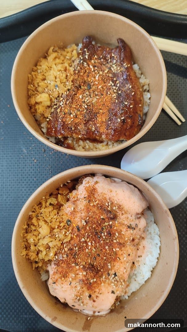 Two bowls of rice with toppings