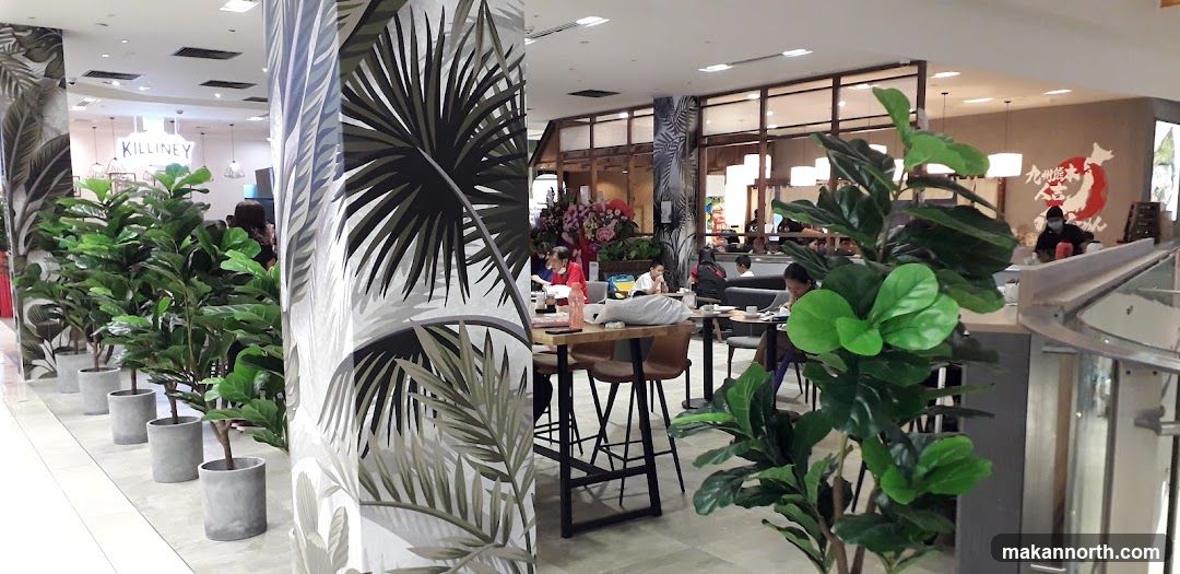 Indoor dining area with plants and seating