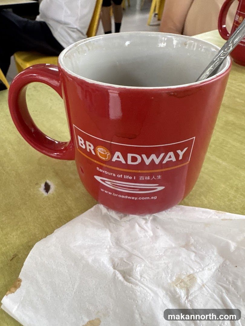 Red mug with Broadway logo