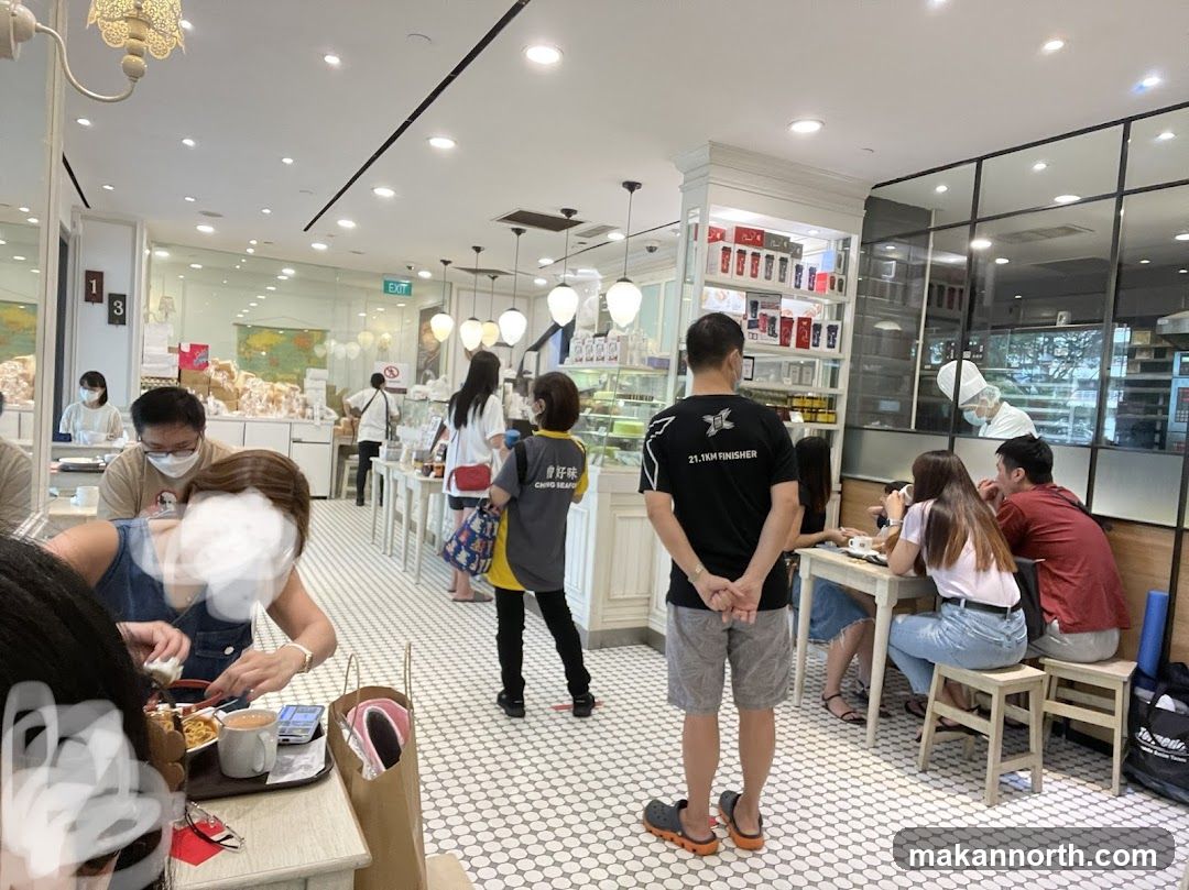 Interior of a cafe with customers and staff