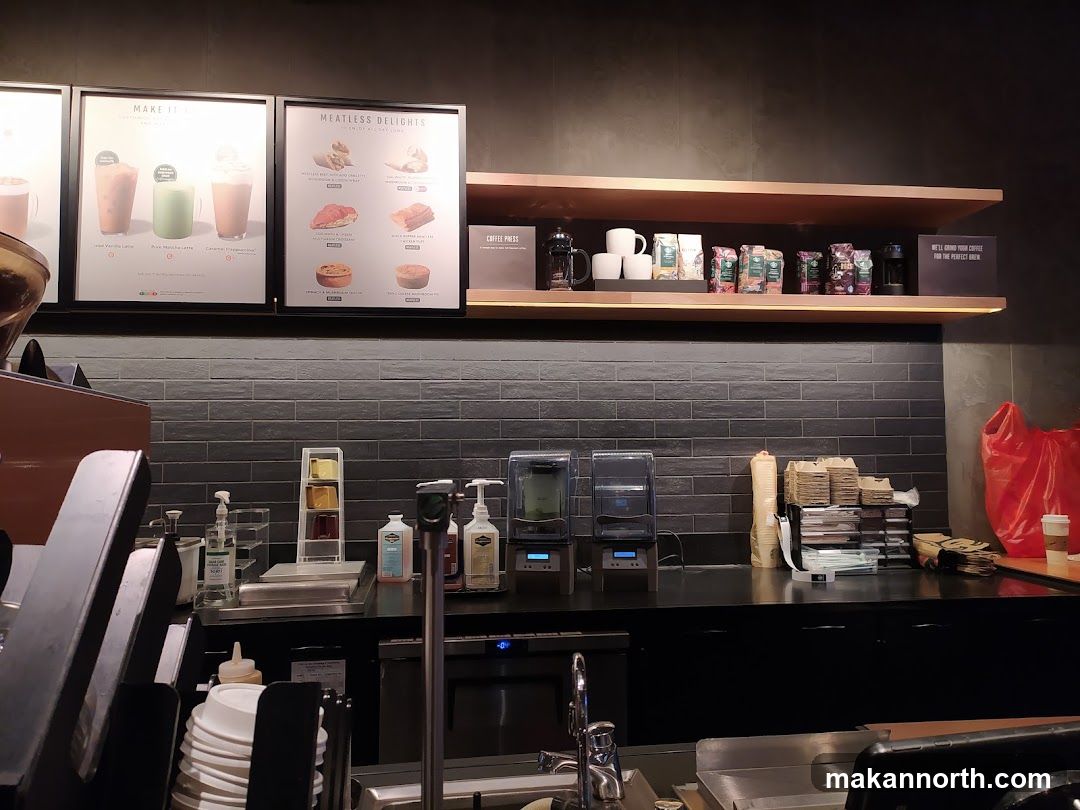 Coffee shop counter with menu boards and merchandise