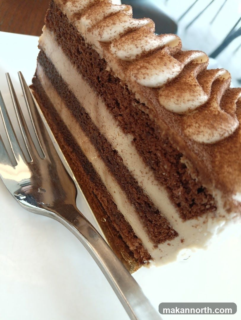 Chocolate Layer Cake with Cream and Cocoa Powder
