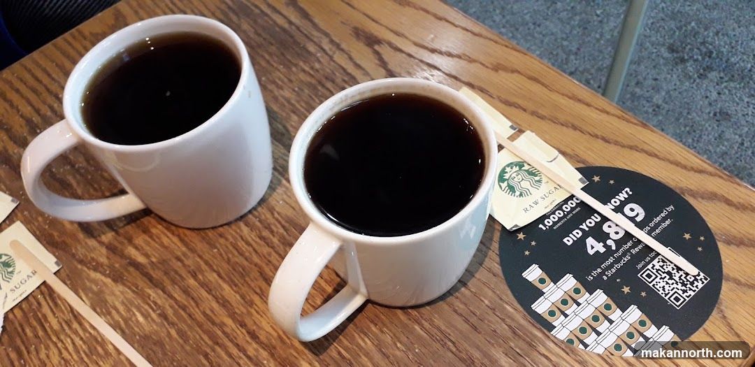 Two Cups of Coffee with Starbucks Branding