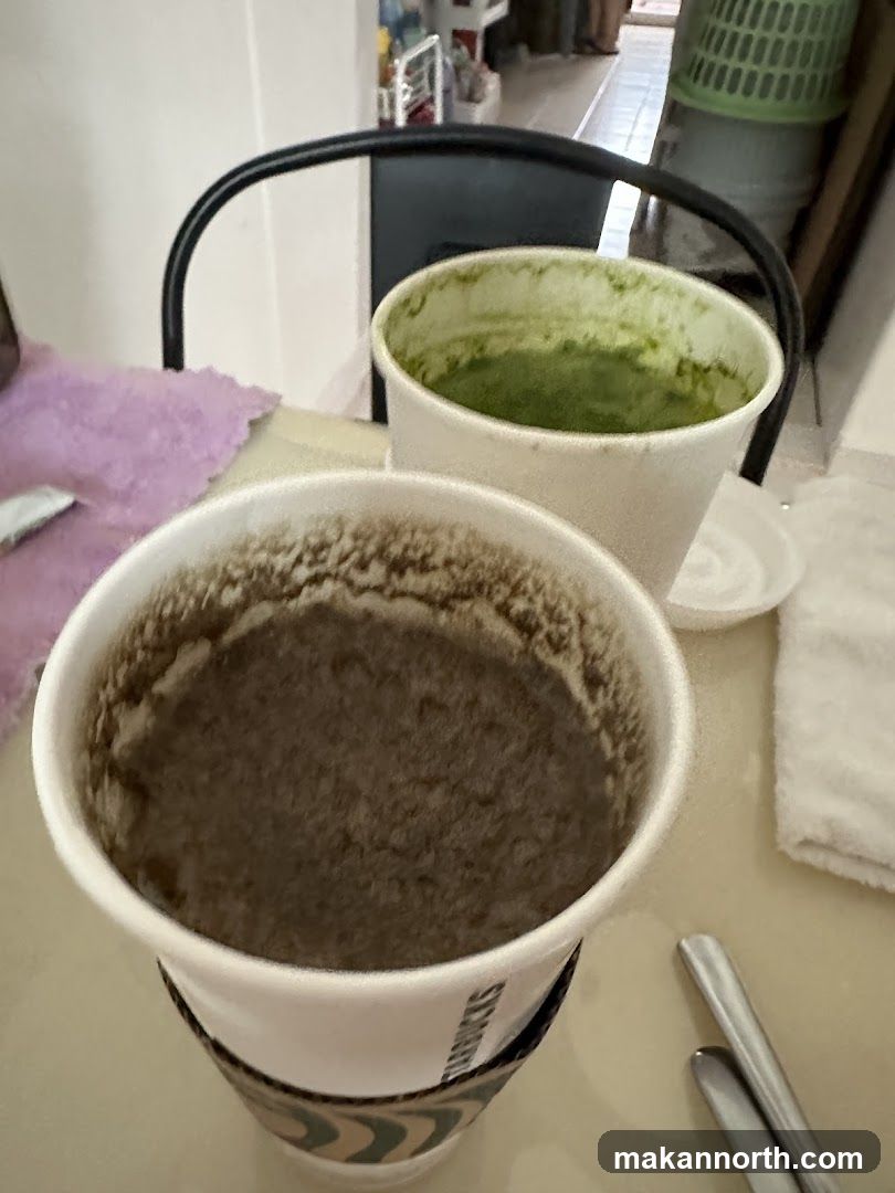 Two drinks in paper cups