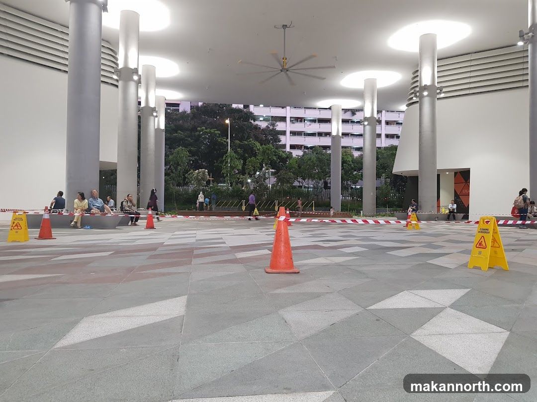 Outdoor area with caution signs and people