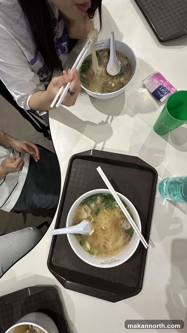 People eating noodles