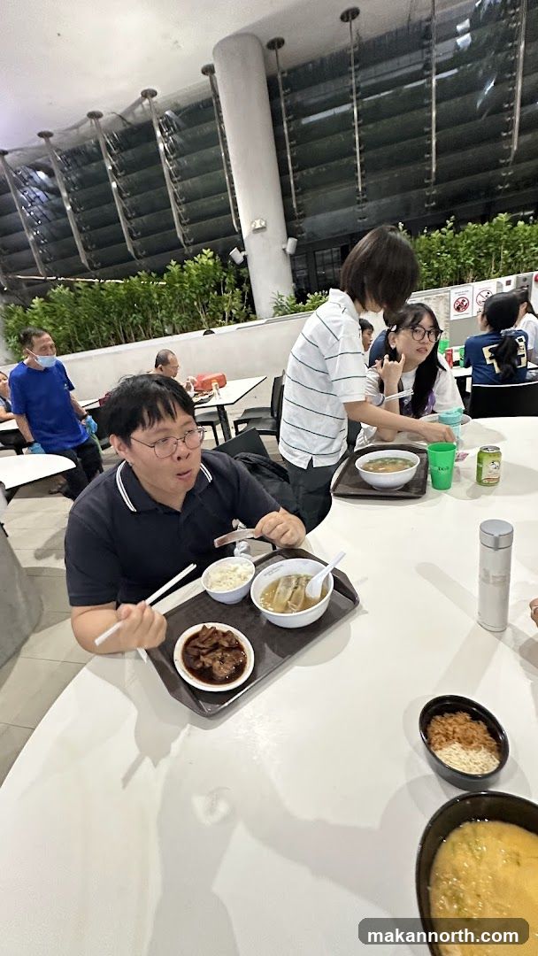 People eating at a food court