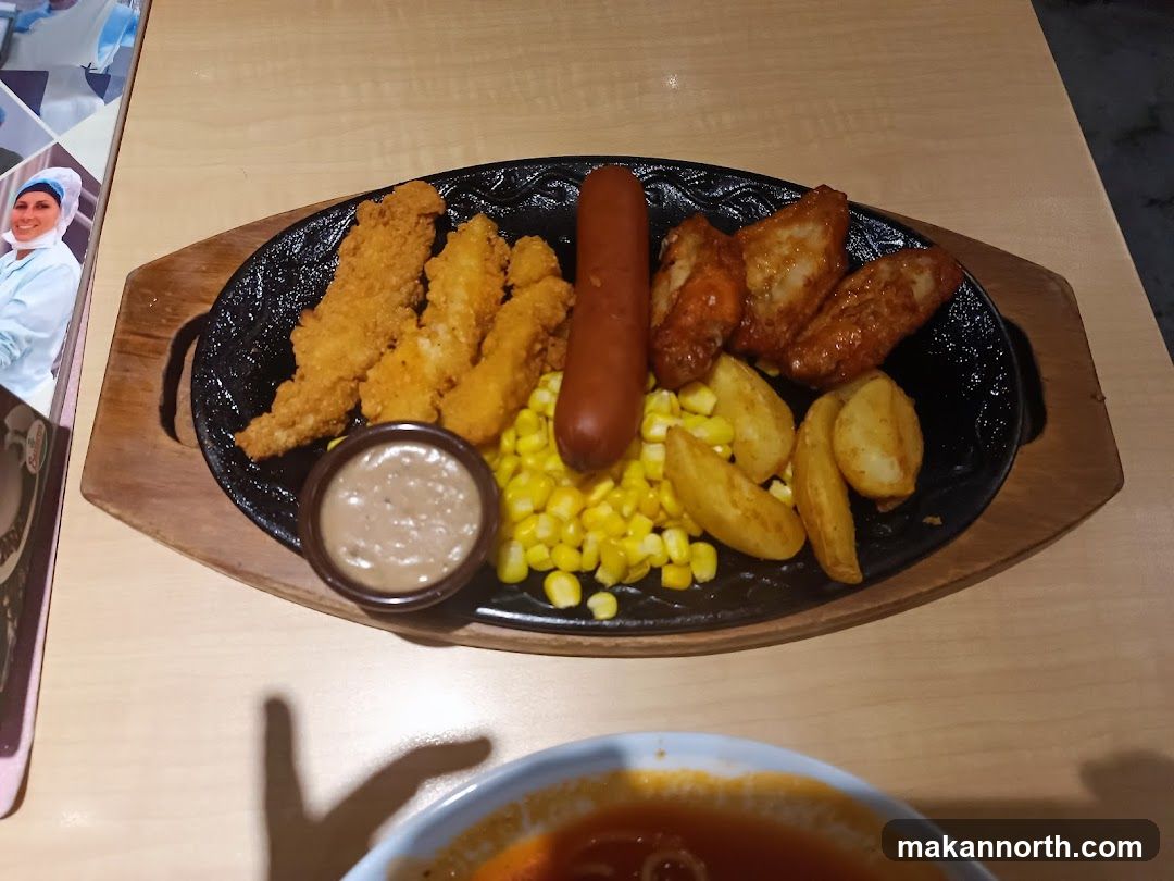 Sizzling Platter with Chicken Strips, Sausage, Wings, and Fries