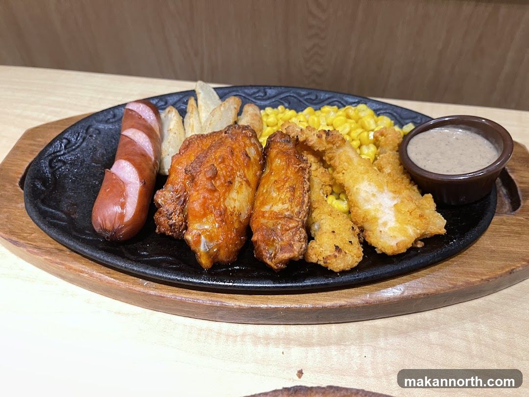 Sizzling Platter with Sausage, Chicken Wings, Fish Strips, Corn, and Fries