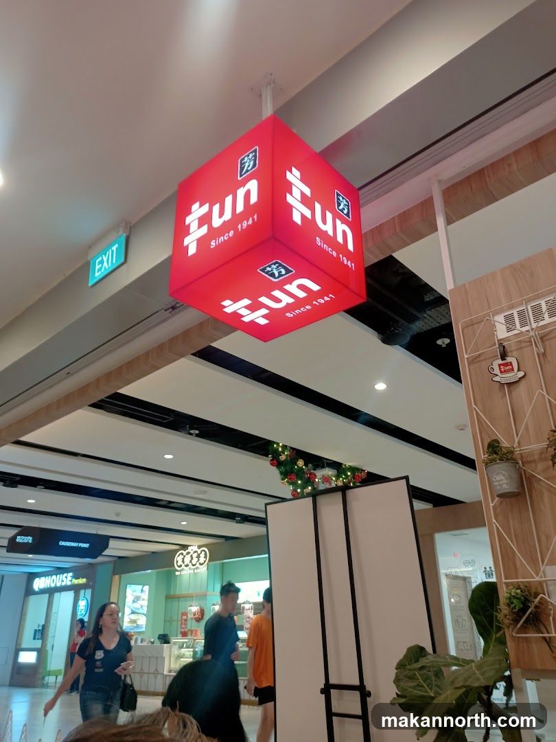 Red cube sign with white text