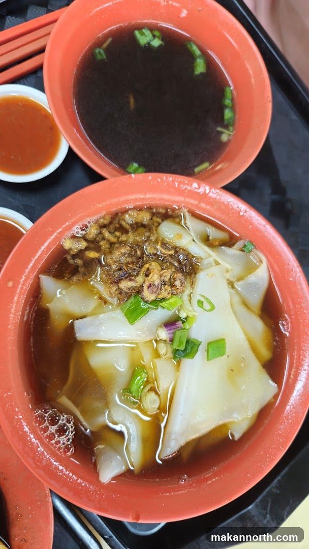 Noodle Soup with Broth and Chili Sauce
