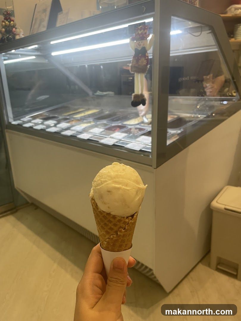 Ice Cream Cone in Front of Display Case