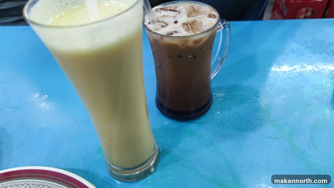 Two Iced Drinks on a Blue Table