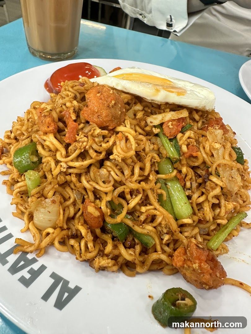 Fried Noodles with Egg and Meatballs