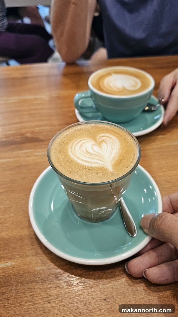 Two coffees with latte art