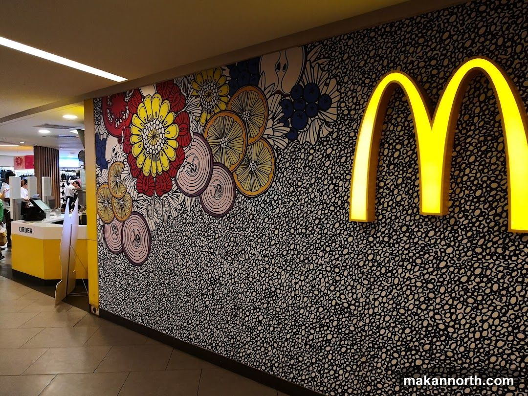McDonald's Interior with Artwork and Golden Arches