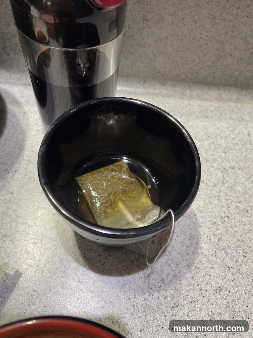 Tea bag steeping in a bowl
