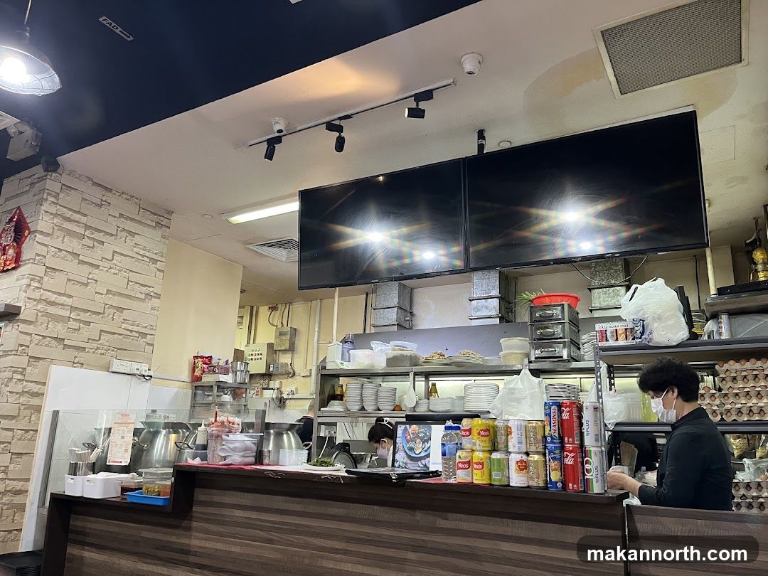 Restaurant Counter with Drinks and Staff