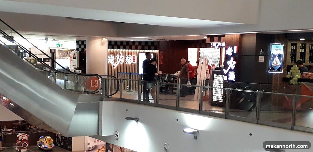 Mall Interior with Escalator and Restaurant
