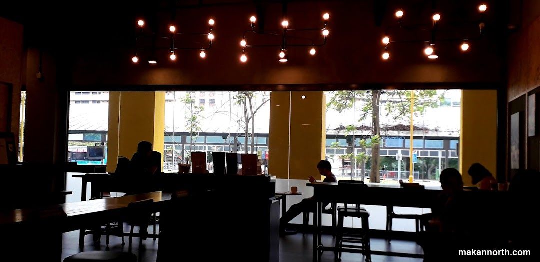 Interior of a cafe with people sitting at tables