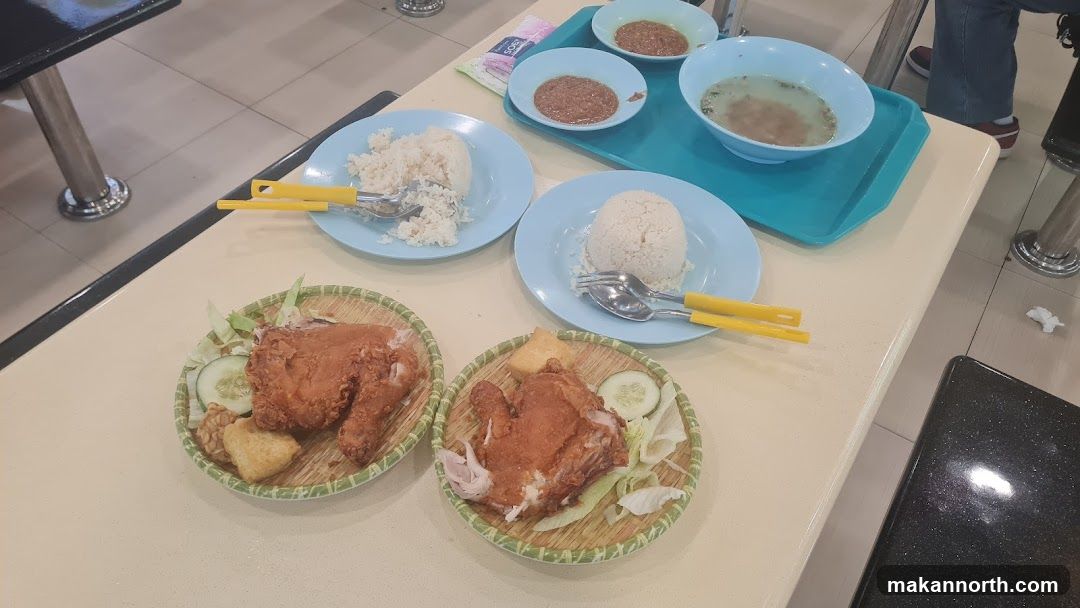 Two plates of fried chicken with rice