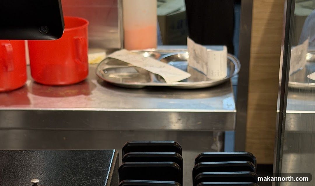 Countertop with Red Cups and Receipts