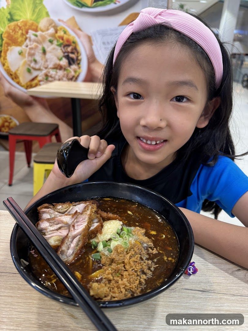 Girl with a bowl of noodles