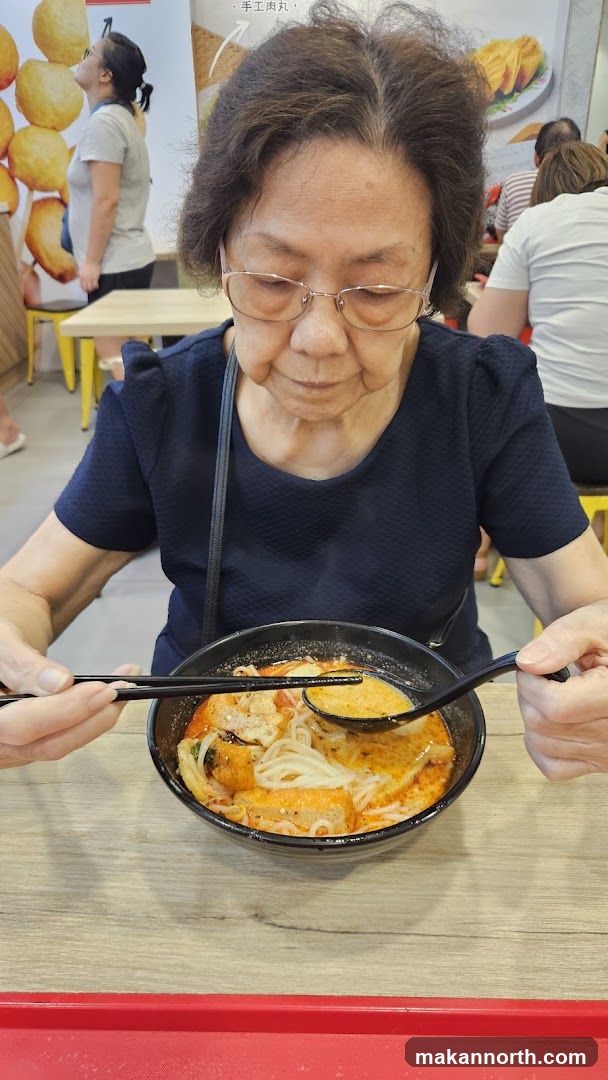 Woman Eating Noodles