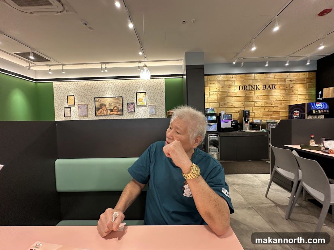 Man sitting at a table in a restaurant