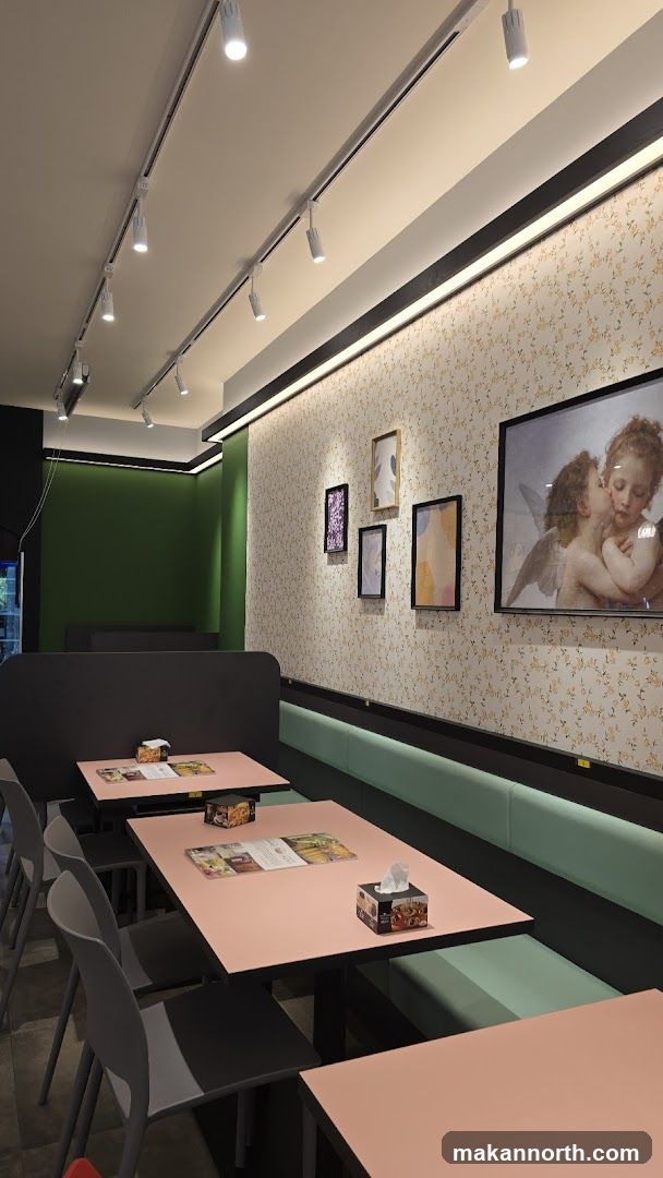 Restaurant Interior with Pink Tables and Booth Seating