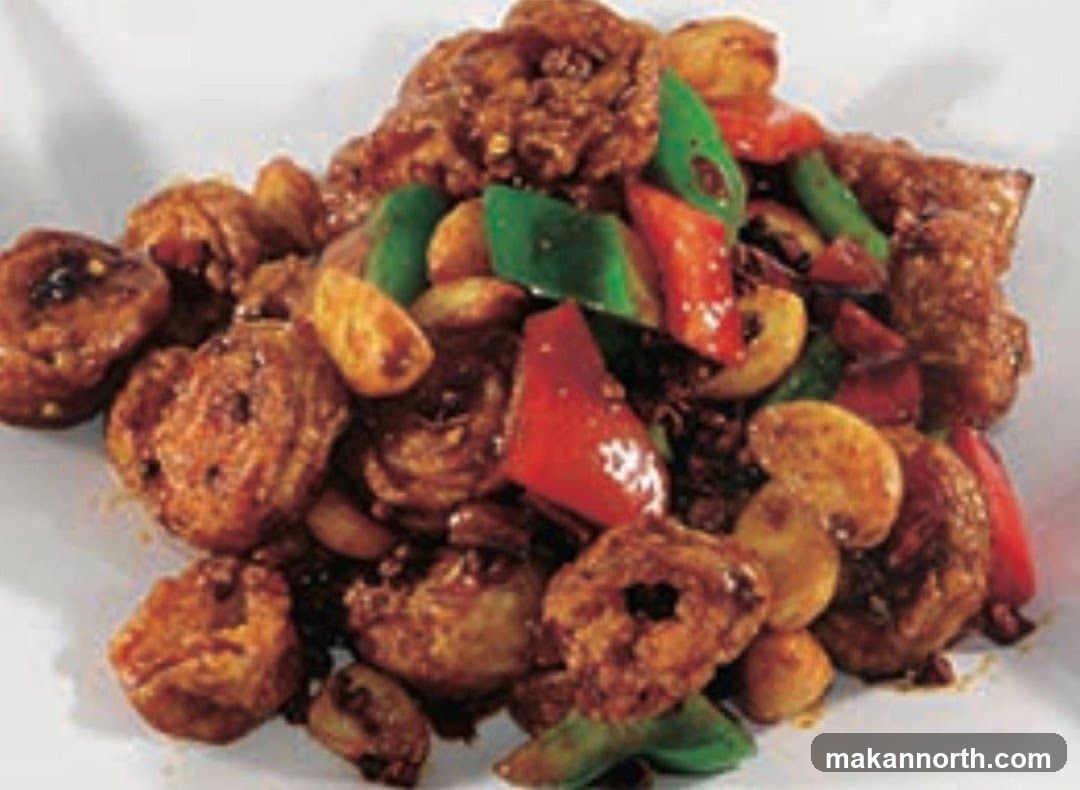 Stir-fried dish with meat, peppers, and cashews