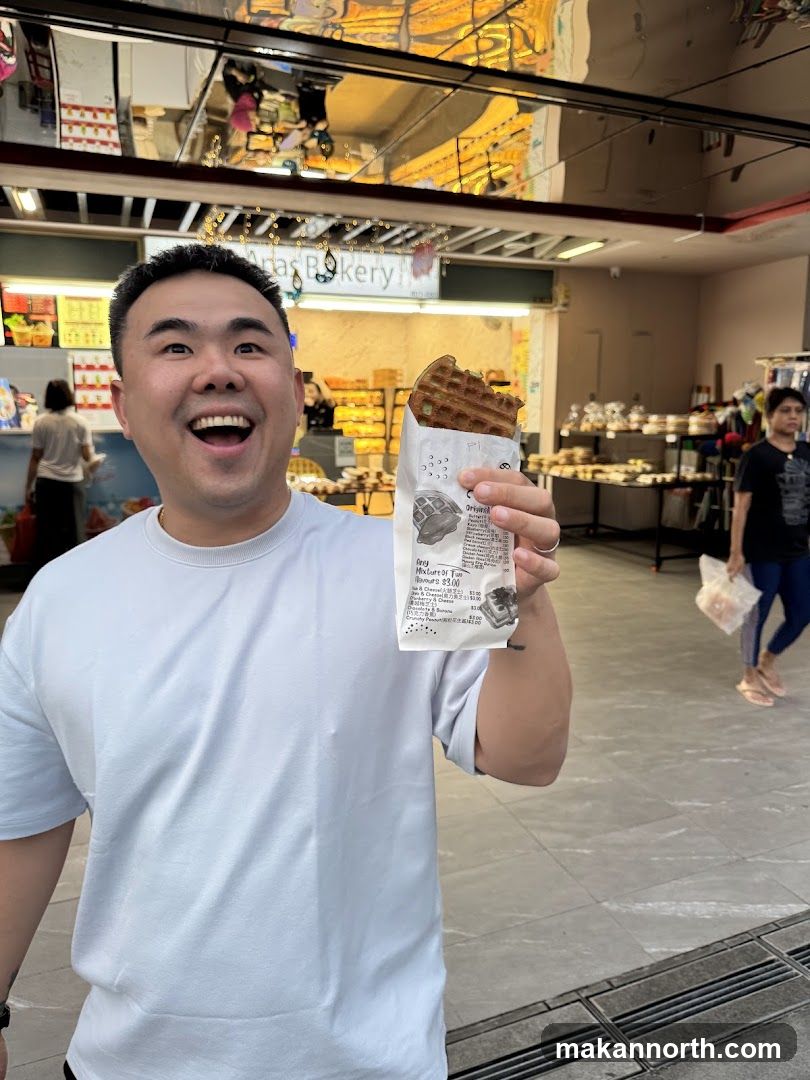 Man Holding a Waffle