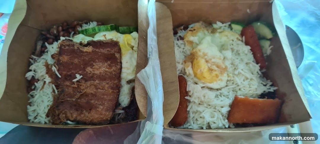 Two takeaway boxes of rice dishes