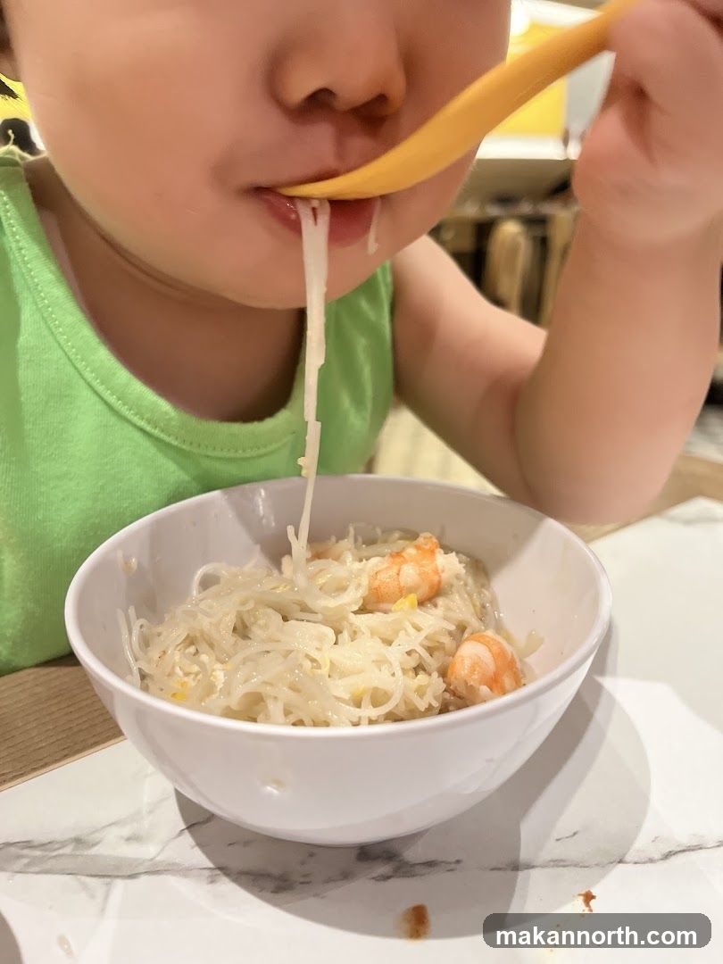 Child Eating Noodles