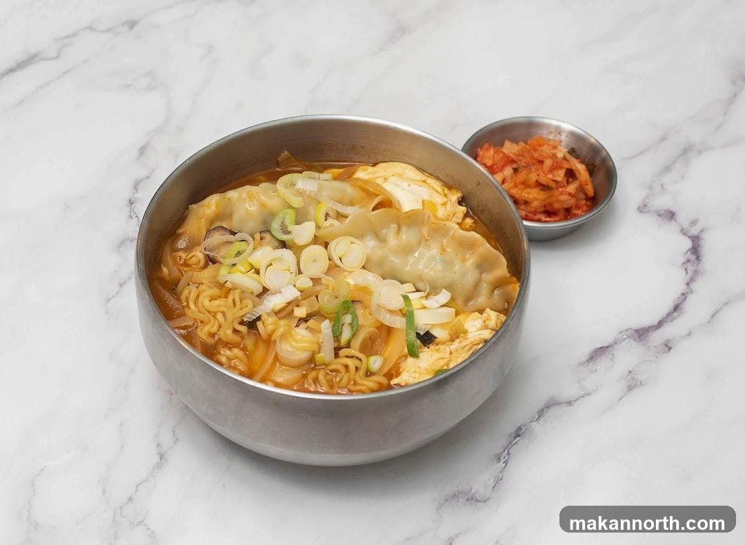 Korean Noodle Soup with Dumplings and Kimchi