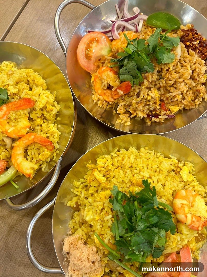 Three bowls of fried rice with shrimp